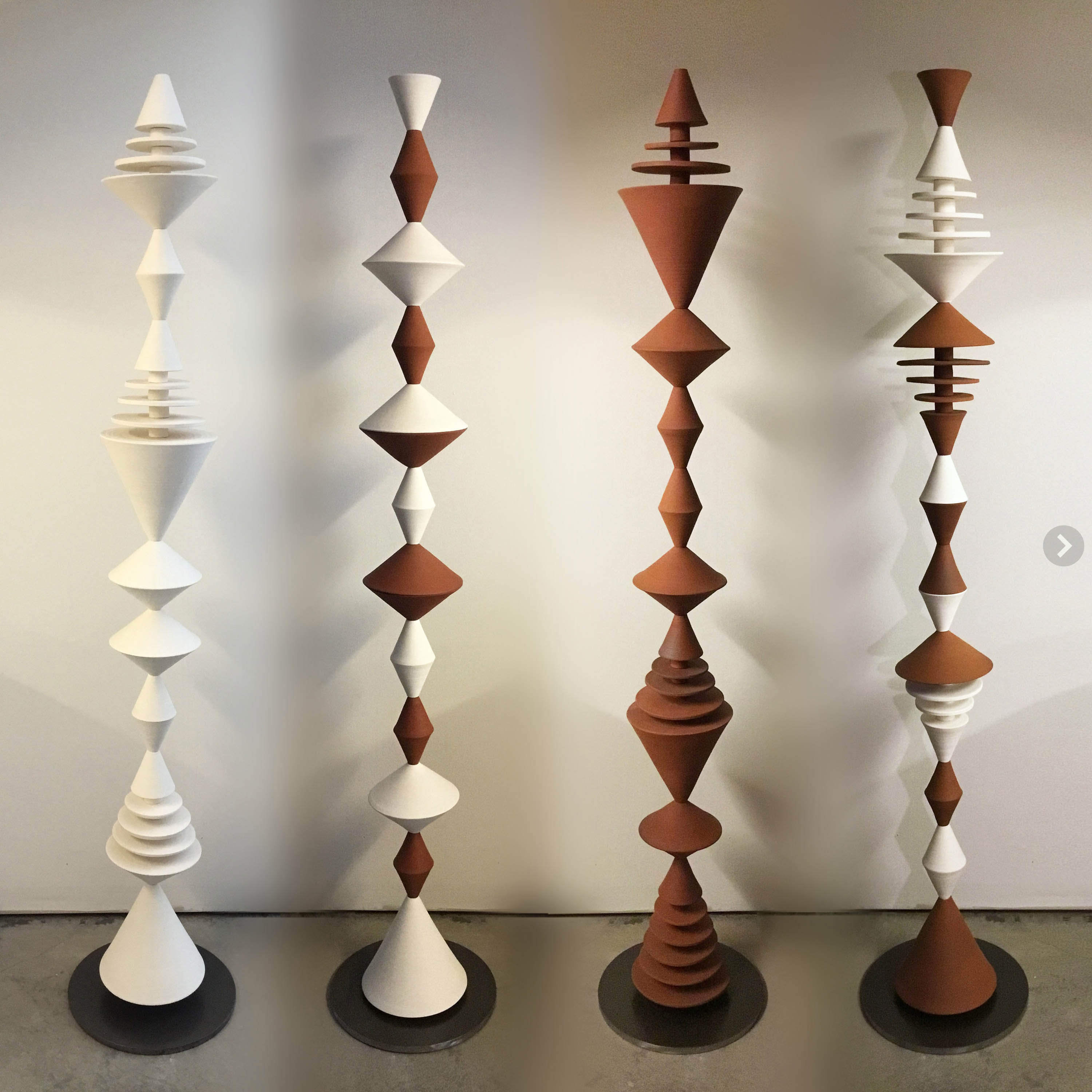 Ceramic sculptures, composed from modular handmade pieces. With a nod to mid-century modern, the geometric forms repeat playfully, complementing modern interiors and architecture. 11 to 60 inches tall, stoneware, pottery decor.