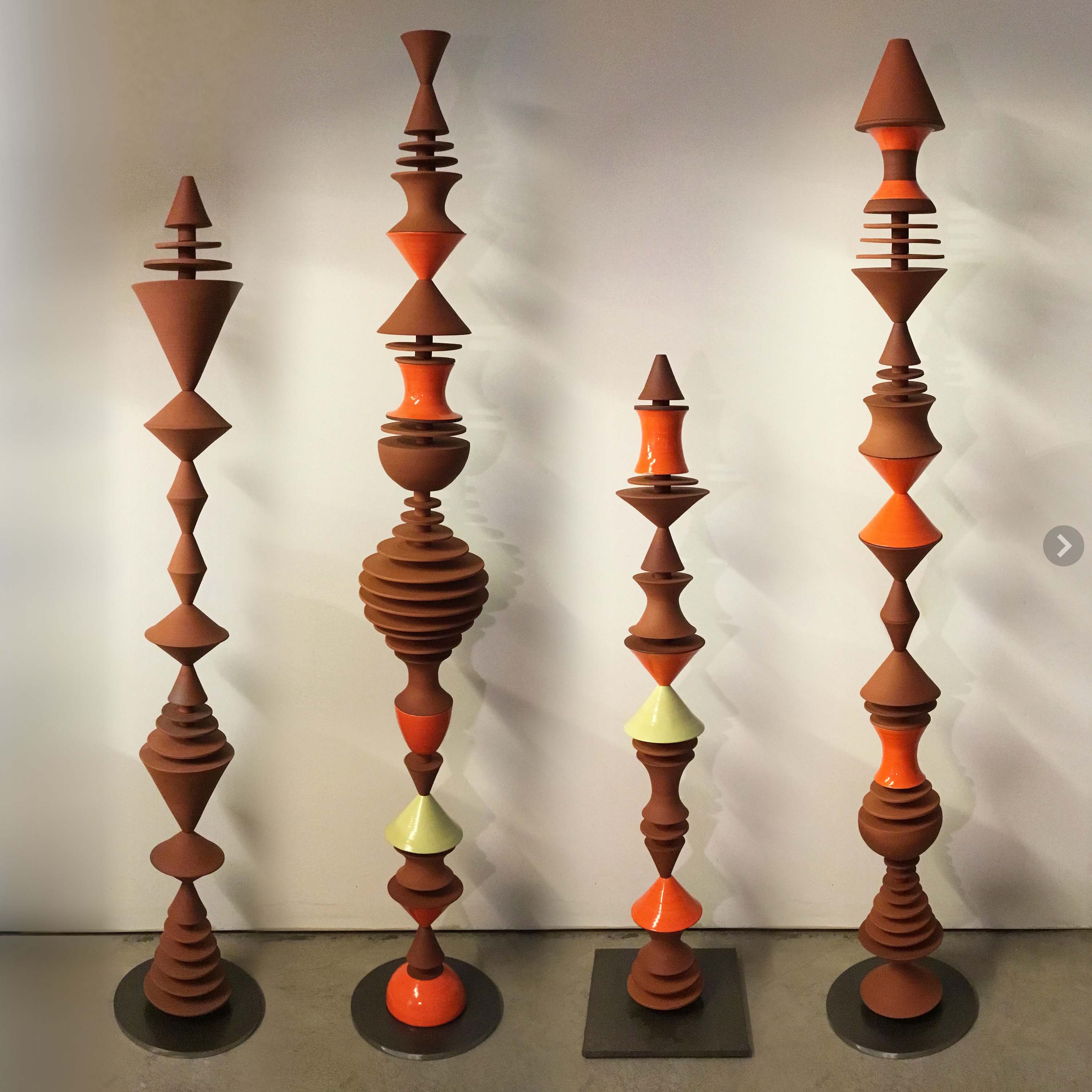Ceramic sculptures, composed from modular handmade pieces. With a nod to mid-century modern, the geometric forms repeat playfully, complementing modern interiors and architecture. 11 to 60 inches tall, stoneware, pottery decor.